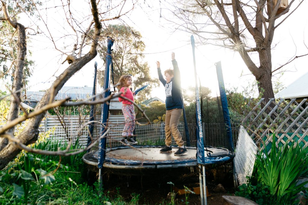Boy and girl on trampoline